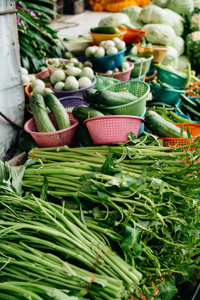 Colorful display of fresh organic vegetables at a vibrant local market stall, perfect for healthy shopping imagery.